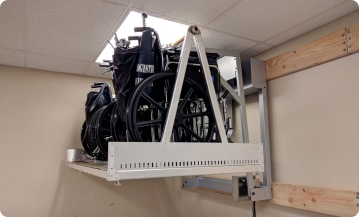close-up of wheelchairs lined up on wheelchair storage rack